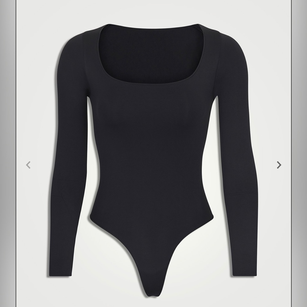 Skims black scoop neck bodysuit. More photos available upon request.